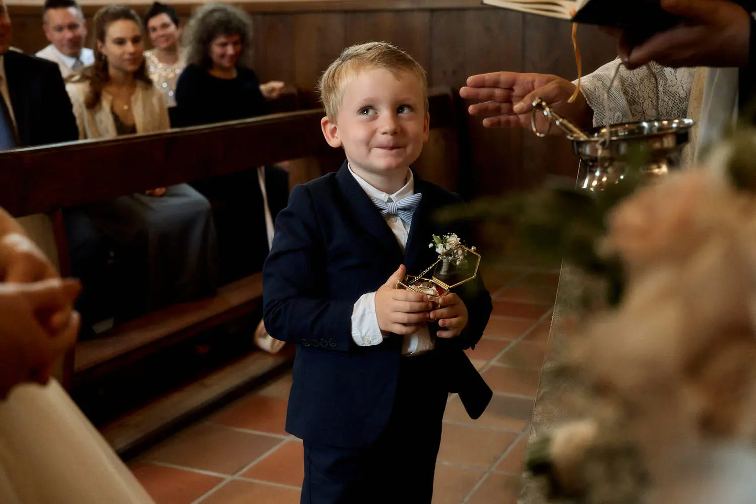 Ring bearer during the church wedding ceremony