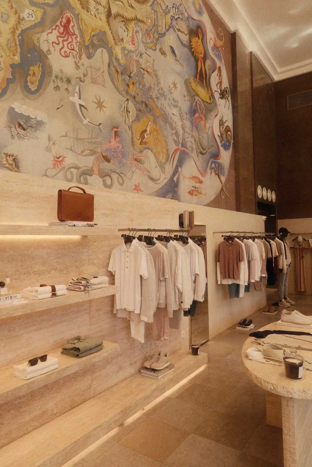 Fashion boutique with shelves and wall mural