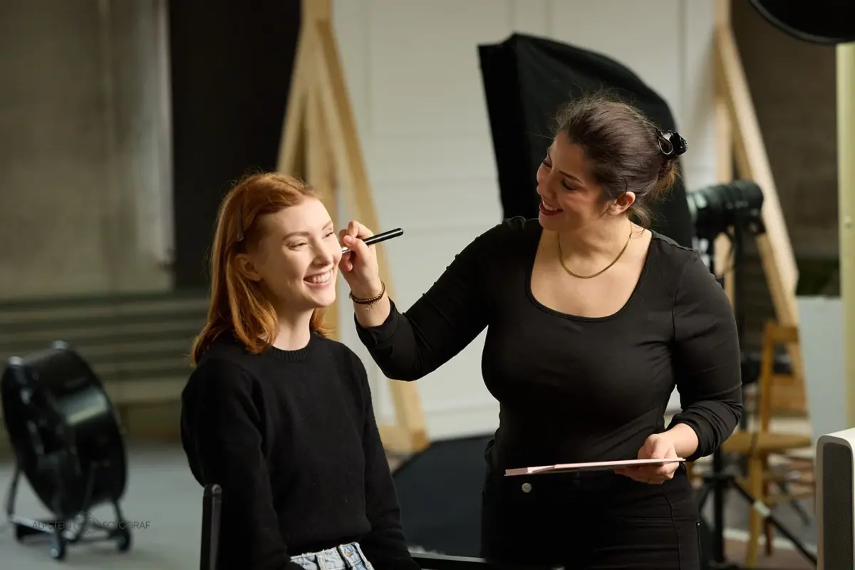 Make-up artist styling a model in the photo studio – photo shoot with photographer St.Gallen