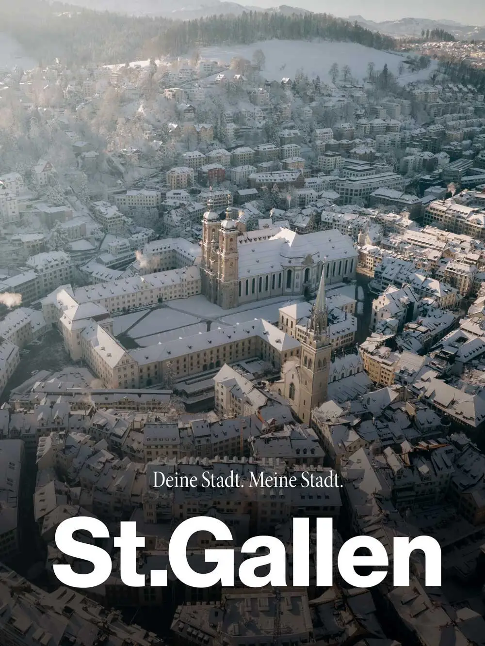 Aerial view of the city of St.Gallen in winter with the Abbey District and cathedral – photographer St.Gallen