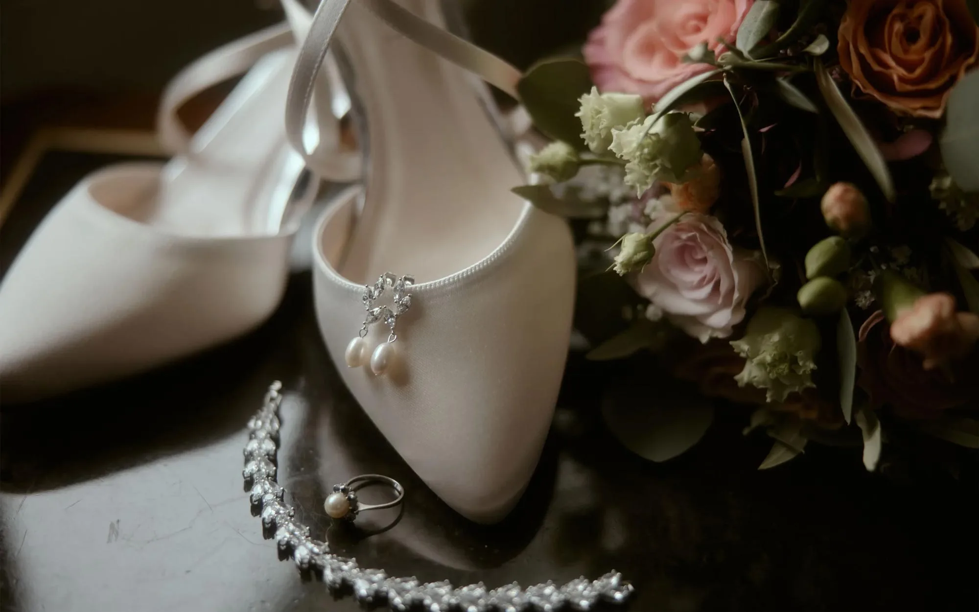 Bridal shoes, pearls and flowers
